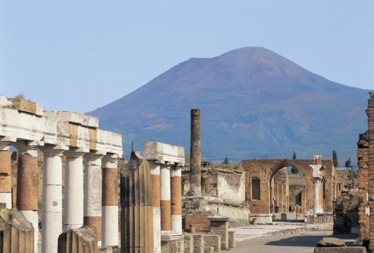 Mount Vesuvius stands tall behind the ruins of Pompeii